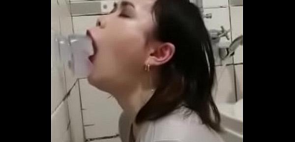  Asian deepthroating a dildo